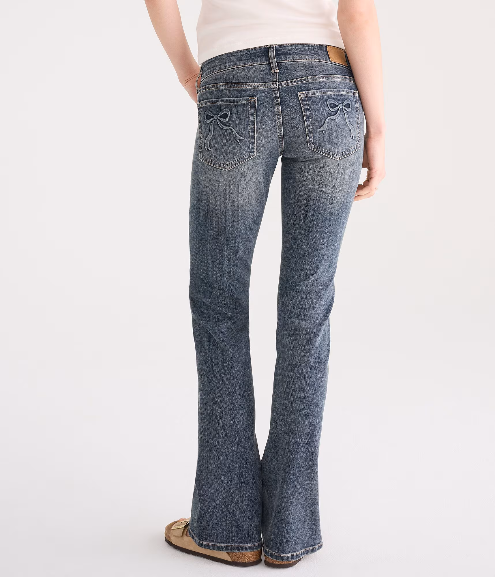 Super Low-Rise Bootcut Bow Pocket Jean dark wash