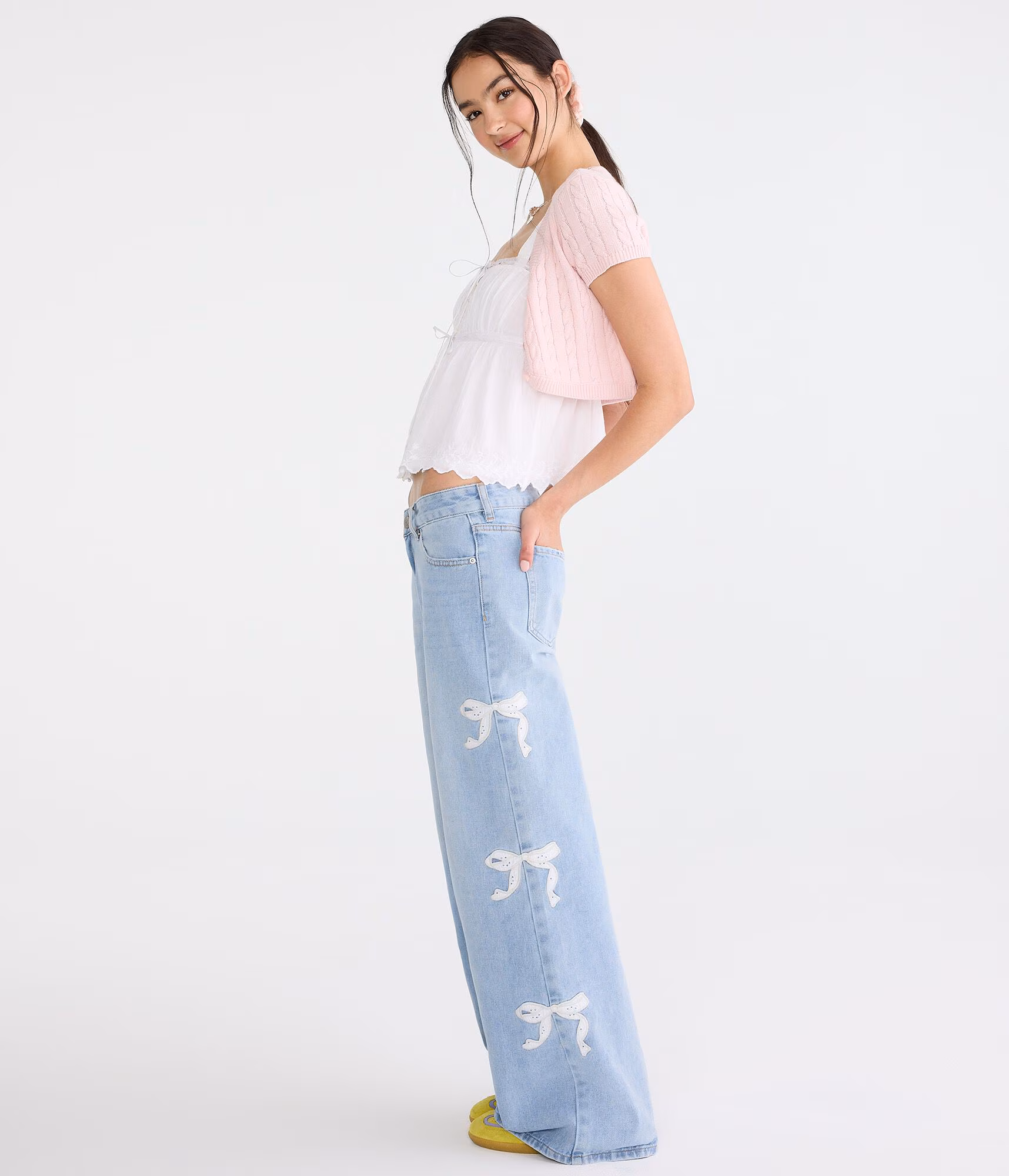 Super Low-Rise Ultra Wide Leg Eyelet Bow Jean light wash